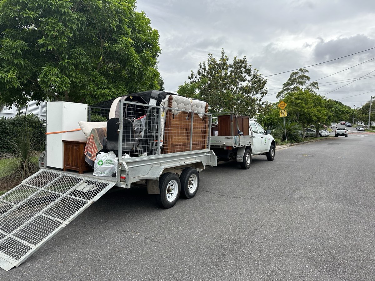 [Your Business Name] ute and trailer loaded for residential removal