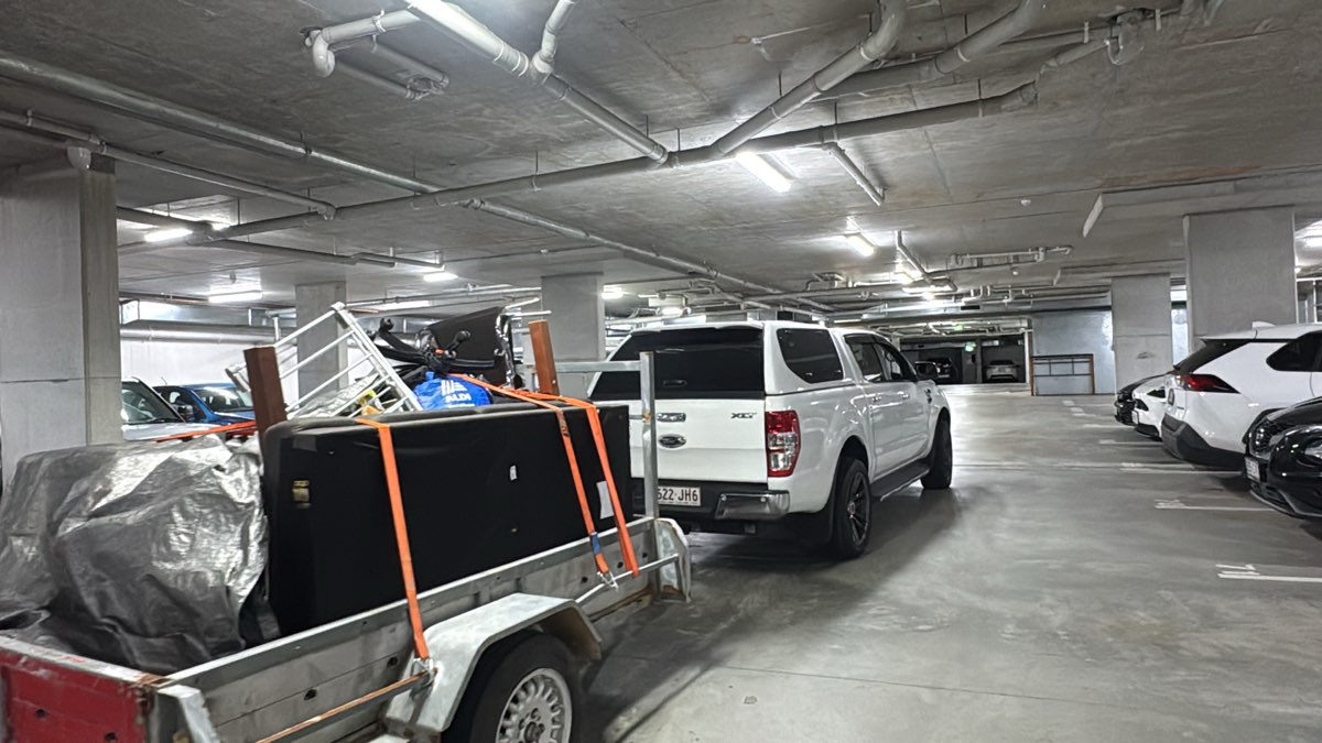 Loaded trailer in underground parking for commercial waste removal